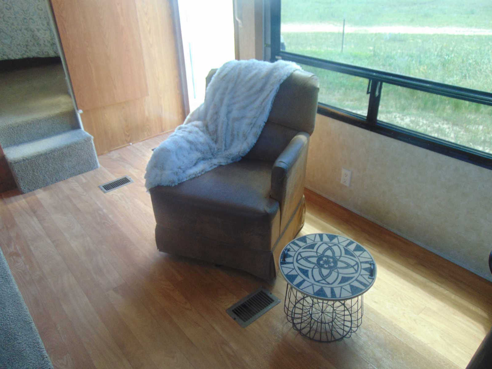 RV area with recliner and side table