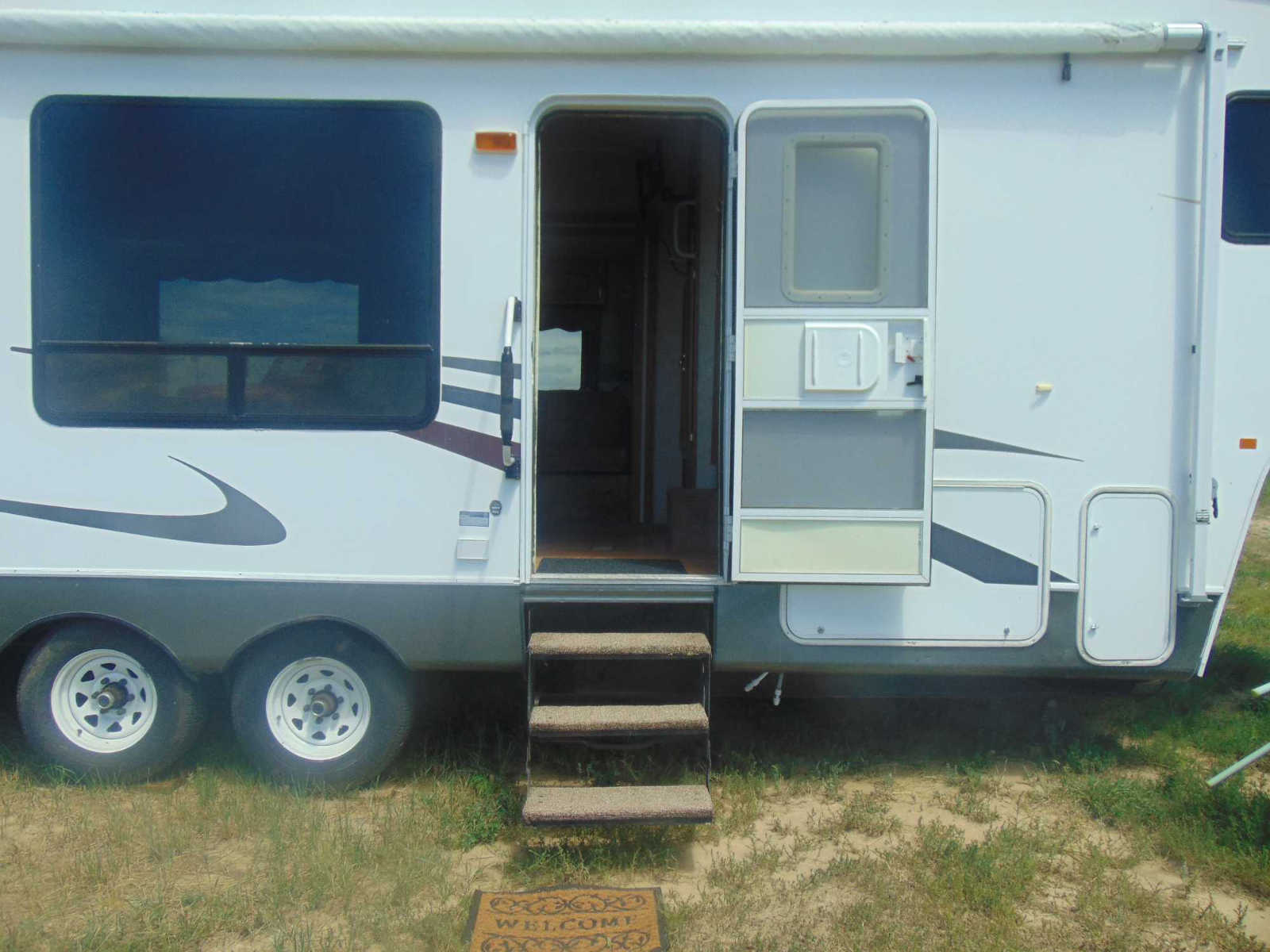 RV entry stairs and welcome mat