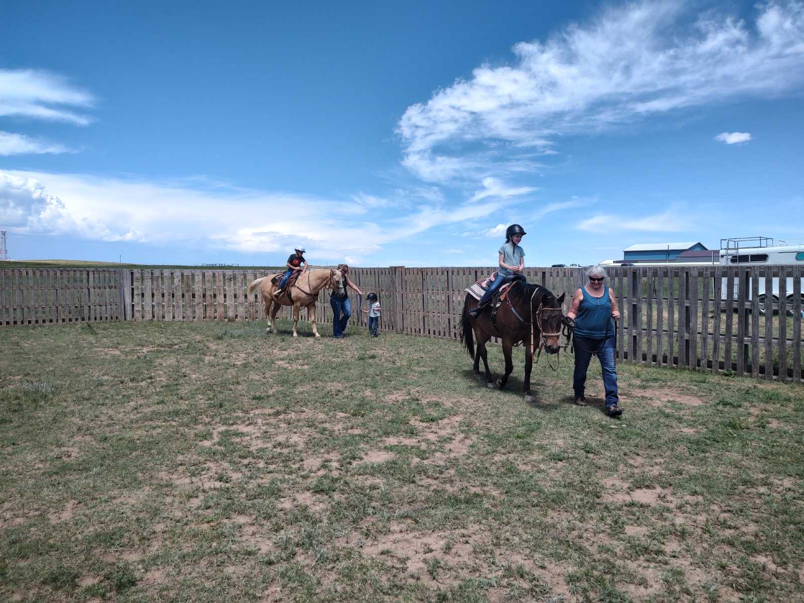 horses maverick and mouse give children rides after their grooming time.